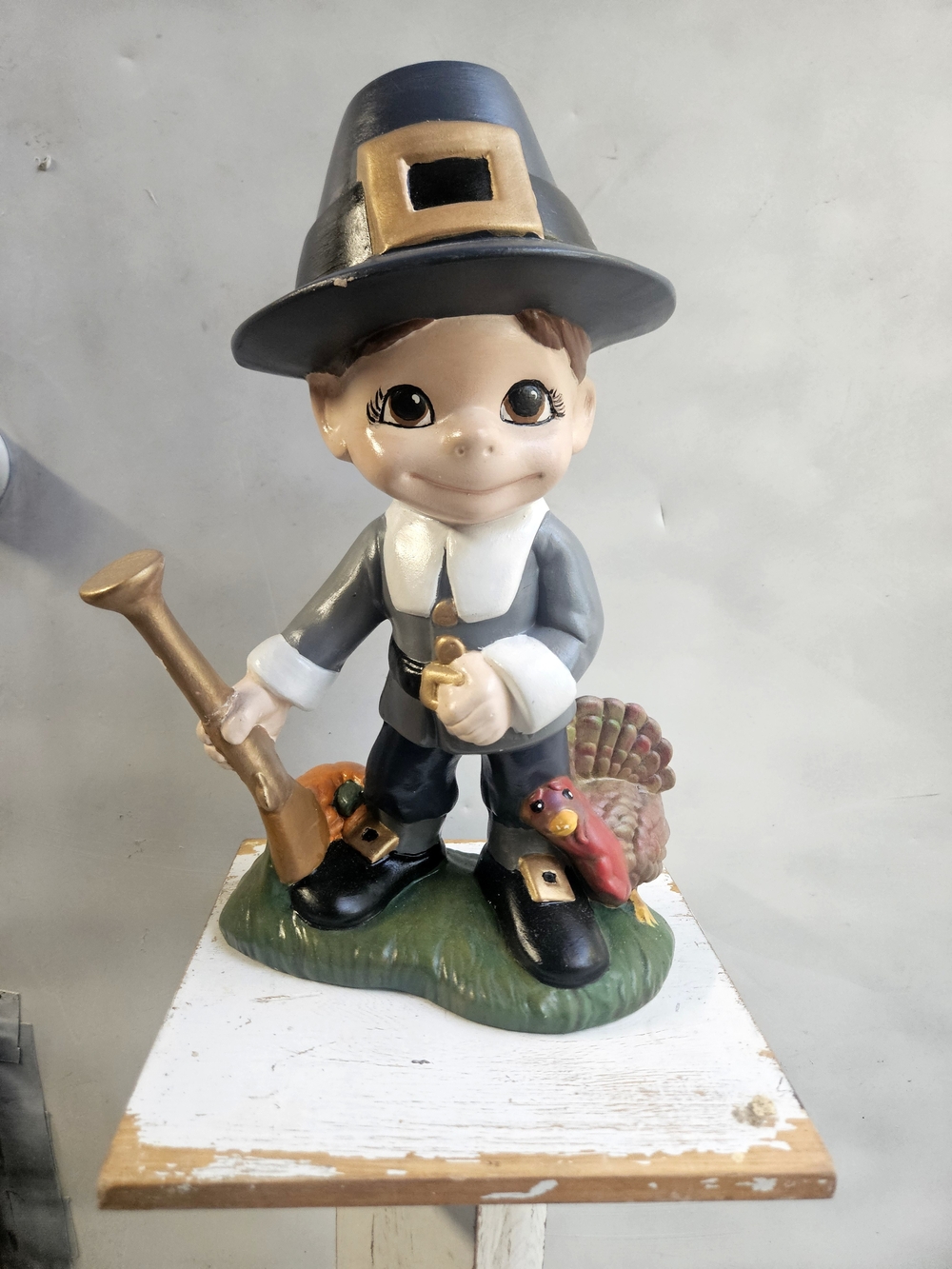 Gray Pilgrim Boy Ceramic Figurine with Gold Accents